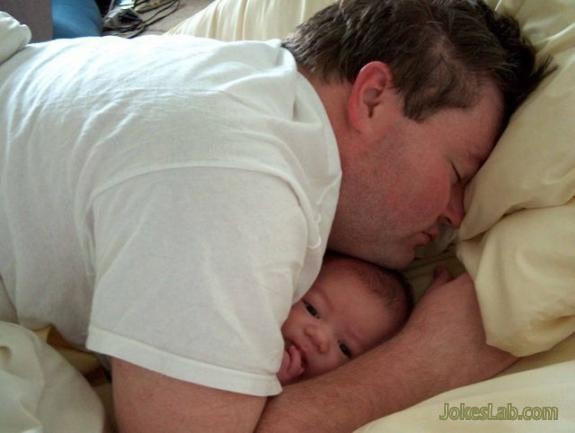 funny daddy sleeping with baby