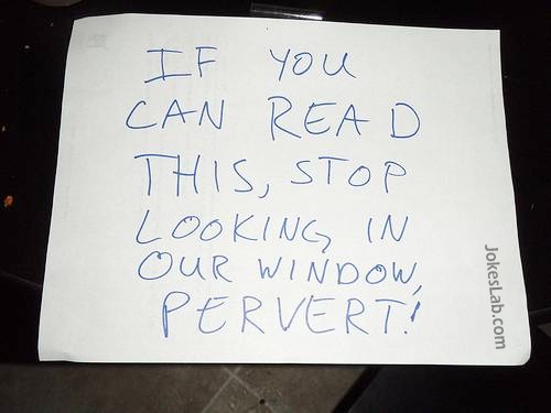 funny sign, if you can read this, stop looking into our window
